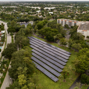 An aerial shot of solar panels in a cascade in the field in Florida